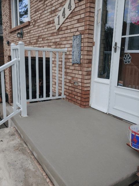 Freshly resurfaced front porch concrete steps and landing on a residential home in Kitchener, Ontario